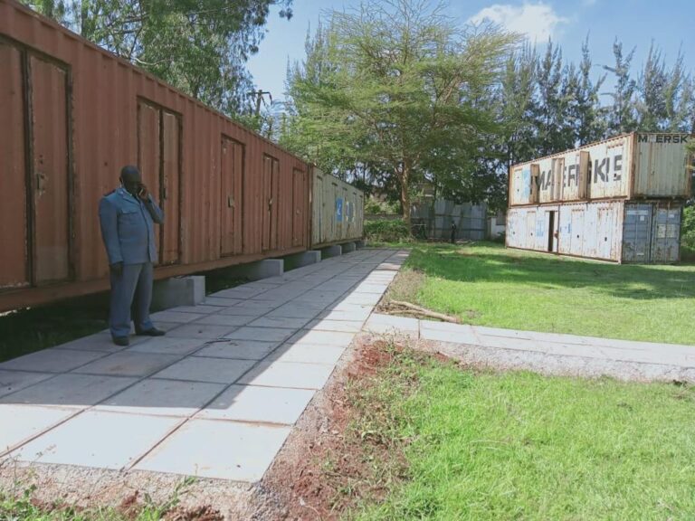 Containers placed on foundations and pathways set