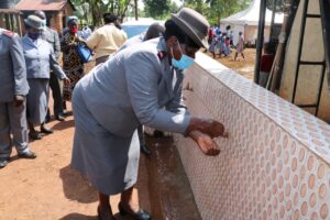 19- Commissioner Grace Chepkurui washes her hands
